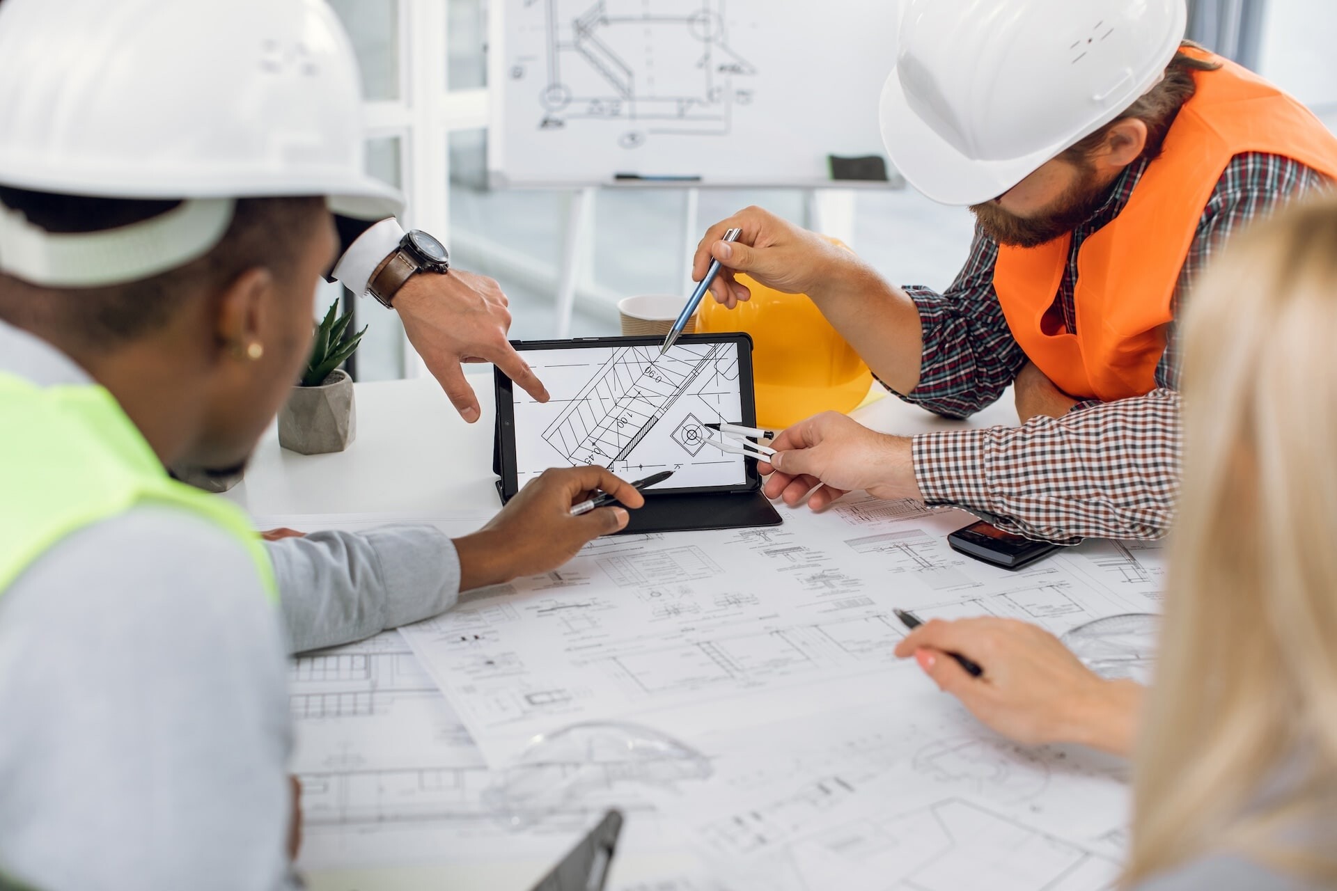 close-up-of-construction-team-analysing-blueprints-2026-01-11-09-57-44-utc