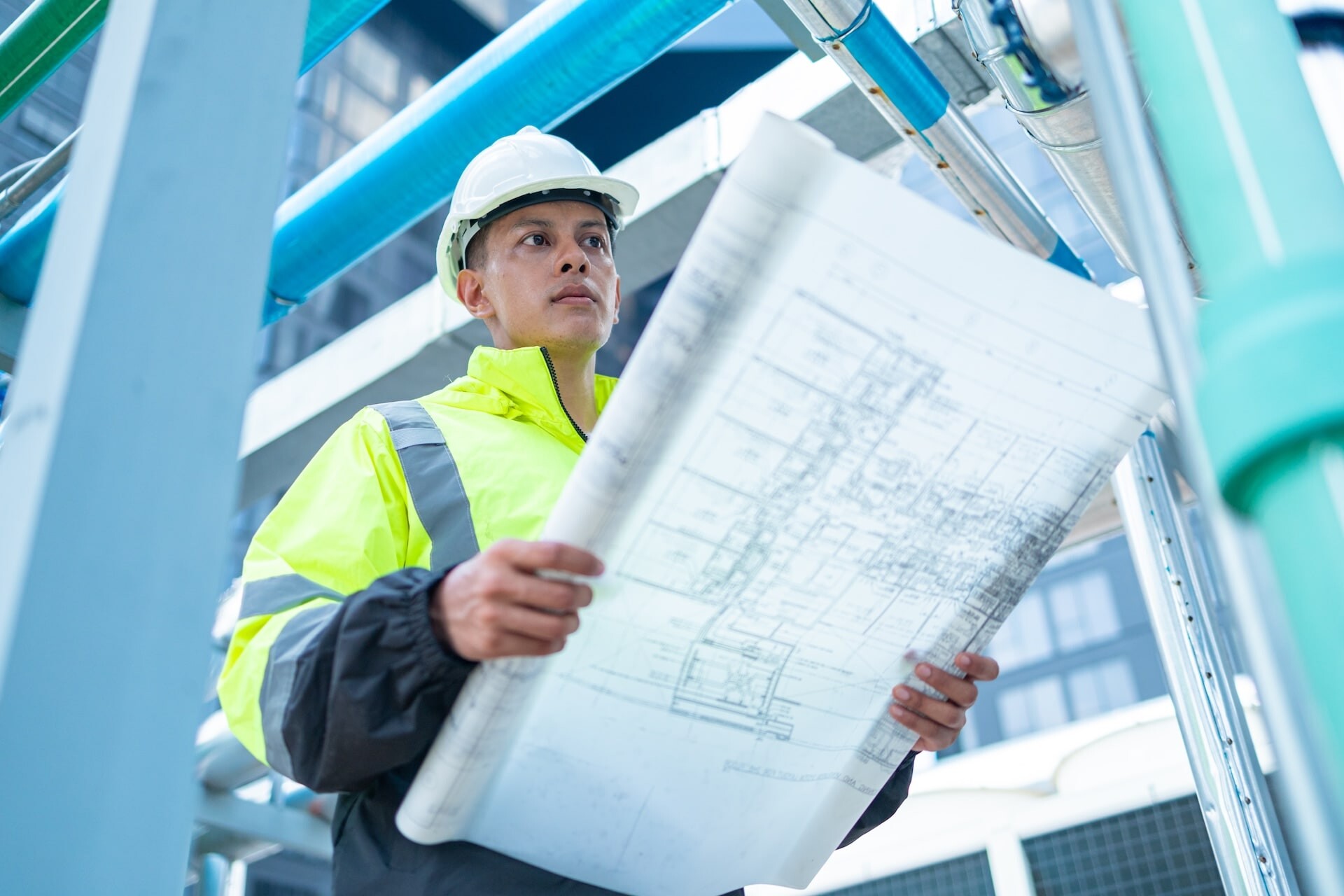 construction-manager-examines-building-plans-at-co-2026-03-19-10-25-40-utc