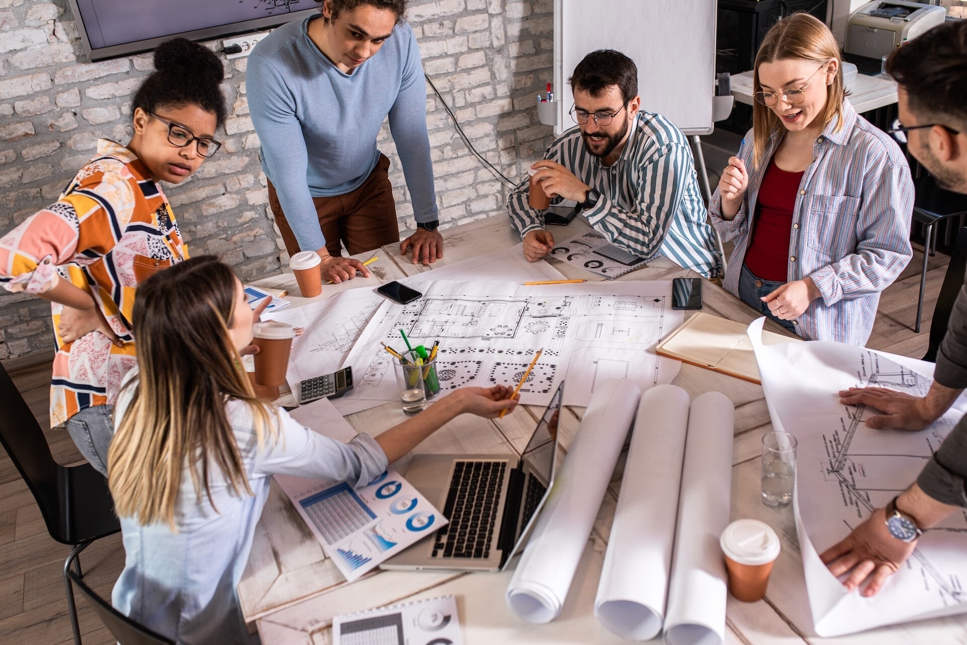 team-collaborating-on-construction-plans-in-office-2026-03-18-15-03-28-utc